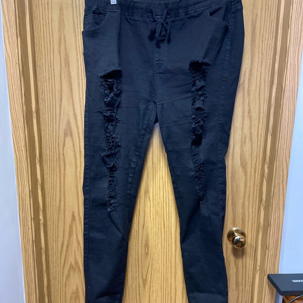 Pull on ripped black skinny jeans